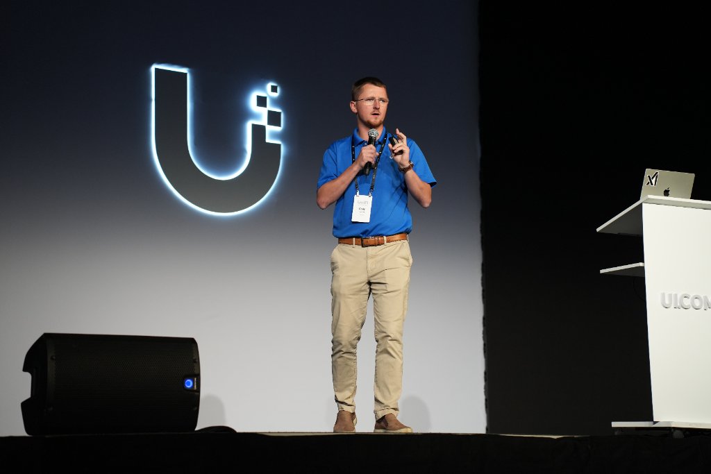 Cody Franklin speaking on stage at the Ubiquiti World Conference